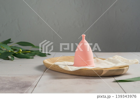 Menstrual cup. Pink feminine hygiene product. Women health concept. Menstrual cup. Pink feminine hygiene product. Women health concept. 139343976