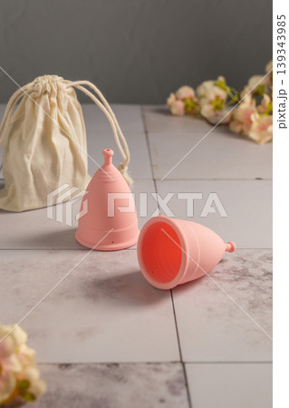 Menstrual cups. Pink feminine hygiene product. Women health concept. 139343985