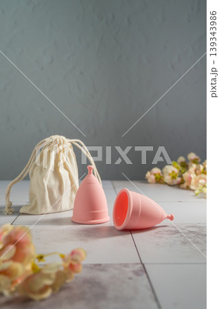 Menstrual cups. Pink feminine hygiene product. Women health concept. Menstrual cups. Pink feminine hygiene product. Women health concept. 139343986