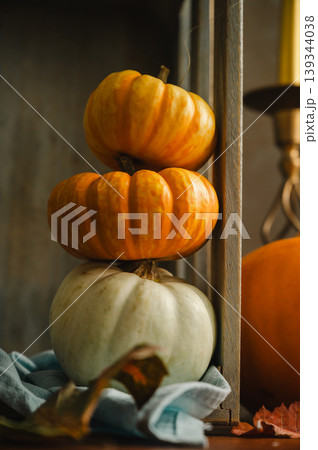 Orange and white pumpkins, rustic wooden moody background, autumn concept Orange and white pumpkins, rustic wooden moody background, autumn concept 139344038