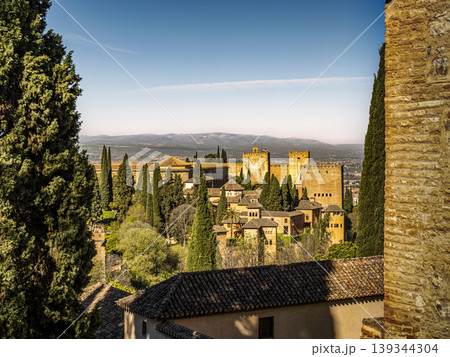 Alhambra Palace in Granada Spain Overlooking Andalusian Landscape With Moorish Towers and Cypress Gardens Alhambra Palace in Granada Spain Overlooking Andalusian Landscape With Moorish Towers and Cypress Gardens 139344304