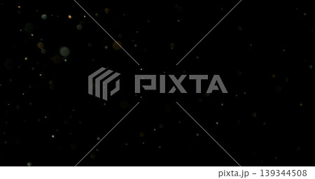 Close-up of floating dust particles in air, isolated on black background. Minimalist abstract texture with soft light, designed as VFX overlay for compositing. Close-up of floating dust particles in air, isolated on black background. Minimalist abstract texture with soft light, designed as VFX overlay for compositing. 139344508