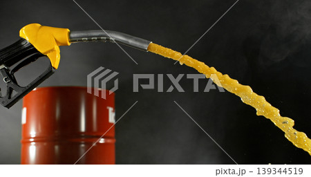 Gasoline jet spraying from fuel nozzle on dark background, no hand visible. Dynamic splash and droplets, refueling concept, energy supply, macro detail, dramatic lighting. Gasoline jet spraying from fuel nozzle on dark background, no hand visible. Dynamic splash and droplets, refueling concept, energy supply, macro detail, dramatic lighting. 139344519