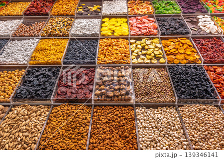 Assorted dried fruits and nuts in market display. Assorted dried fruits and nuts in market display. 139346141