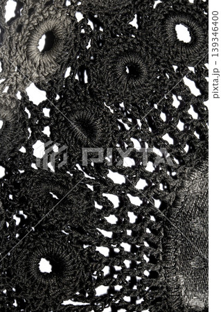 Close up of vintage black gothic lace fabric white on black background embroidery Close up of vintage black gothic lace fabric white on black background embroidery 139346400
