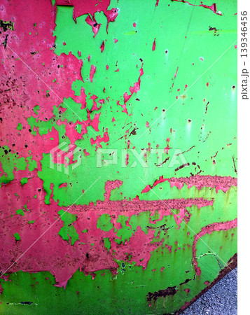 Close up of aged distressed chipped rusted paint work on a wall in green and red Close up of aged distressed chipped rusted paint work on a wall in green and red 139346456