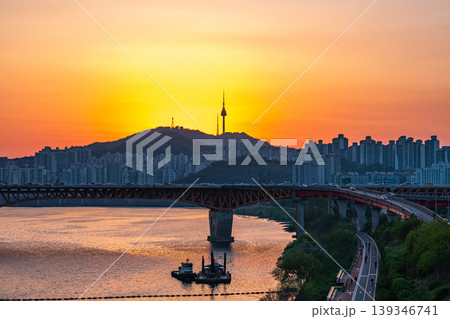 Seoul, South Korea - Apr. 24, 2026 : Sunset Cityscape of Seoul with N Seoul Tower, Seongsu Bridge and Busy Traffic on Gangbyeonbukro Highway 139346741