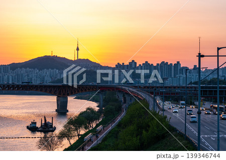 Seoul, South Korea - Apr. 24, 2026 : Sunset Cityscape of Seoul with N Seoul Tower, Seongsu Bridge and Busy Traffic on Gangbyeonbukro Highway Seoul, South Korea - Apr. 24, 2026 : Sunset Cityscape of Seoul with N Seoul Tower, Seongsu Bridge and Busy Traffic on Gangbyeonbukro Highway 139346744