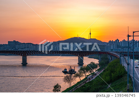 Seoul, South Korea - Apr. 24, 2026 : Sunset Cityscape of Seoul with N Seoul Tower, Seongsu Bridge and Busy Traffic on Gangbyeonbukro Highway Seoul, South Korea - Apr. 24, 2026 : Sunset Cityscape of Seoul with N Seoul Tower, Seongsu Bridge and Busy Traffic on Gangbyeonbukro Highway 139346745
