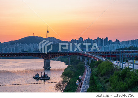 Seoul, South Korea - Apr. 24, 2026 : Sunset Cityscape of Seoul with N Seoul Tower, Seongsu Bridge and Busy Traffic on Gangbyeonbukro Highway Seoul, South Korea - Apr. 24, 2026 : Sunset Cityscape of Seoul with N Seoul Tower, Seongsu Bridge and Busy Traffic on Gangbyeonbukro Highway 139346750