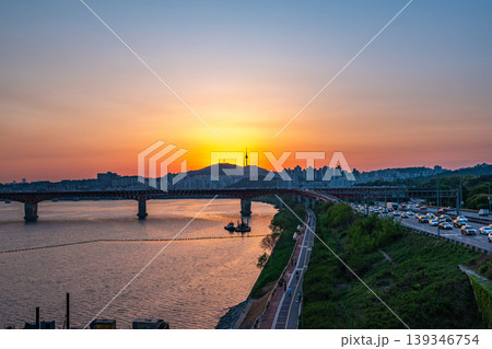 Seoul, South Korea - Apr. 24, 2026 : Sunset Cityscape of Seoul with N Seoul Tower, Seongsu Bridge and Busy Traffic on Gangbyeonbukro Highway Seoul, South Korea - Apr. 24, 2026 : Sunset Cityscape of Seoul with N Seoul Tower, Seongsu Bridge and Busy Traffic on Gangbyeonbukro Highway 139346754