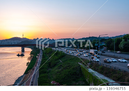 Seoul, South Korea - Apr. 24, 2026 : Sunset Cityscape of Seoul with N Seoul Tower, Seongsu Bridge and Busy Traffic on Gangbyeonbukro Highway 139346755