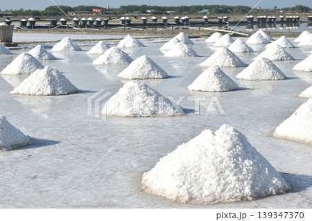 saline water making dry salt by solar evaporation Thai cultures and agriculture manufacturing in farm on sunny day saline water making dry salt by solar evaporation Thai cultures and agriculture manufacturing in farm on sunny day 139347370