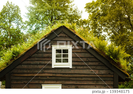House roof covered with moss House roof covered with moss 139348175