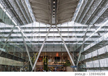 Large glass atrium with structural beams and multi level interior Large glass atrium with structural beams and multi level interior 139348208