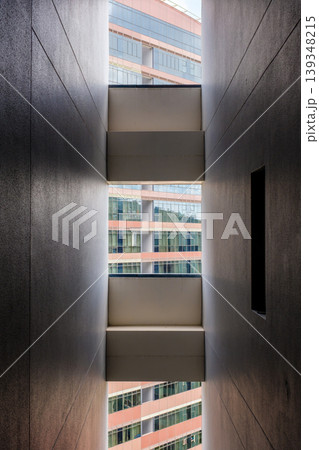 Architectural view between two buildings with modern glass facades 139348215