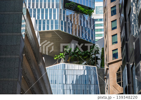 Modern buildings with greenery and geometric facade design Modern buildings with greenery and geometric facade design 139348220