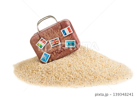 Vintage suitcase on sand isolated travel vacation concept minimal 139348241