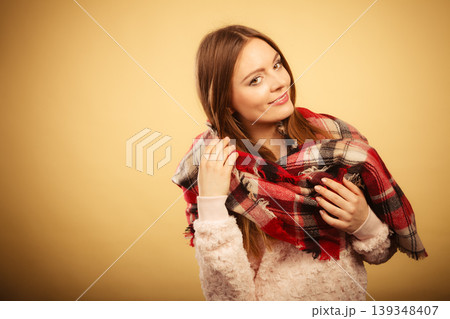 Woman wearing woolen checked scarf warm autumn clothing Woman wearing woolen checked scarf warm autumn clothing 139348407