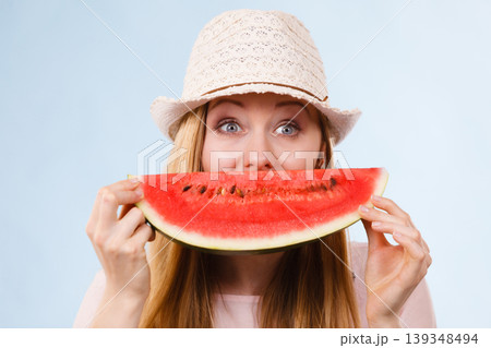 Happy woman holding watermelon Happy woman holding watermelon 139348494