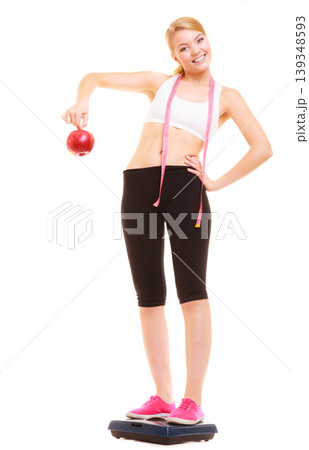 Happy woman weighing scale. Healthy nutrition . 139348593