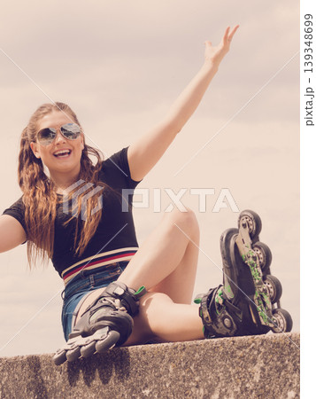 Fit girl with roller skates outdoor 139348699