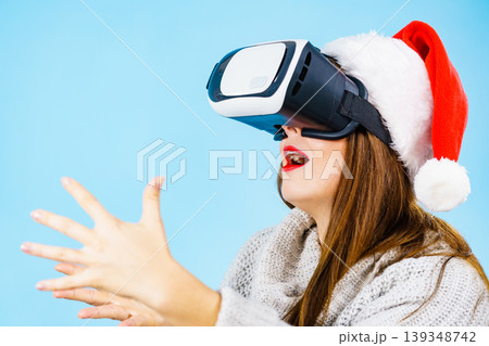 Girl watching 3d film tour in virtual reality glasses. 139348742