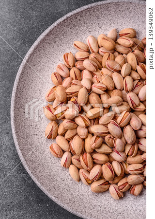 Salted pistachio nuts in shells as a healthy, high calorie food ingredient. Pistachio nuts Salted pistachio nuts in shells as a healthy, high calorie food ingredient. Pistachio nuts 139349062