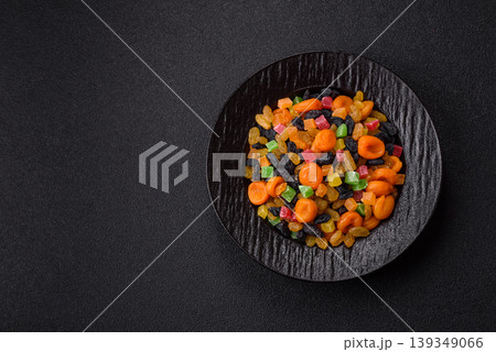 Dried apricots, raisins, and candied fruits as ingredients for baked goods and sweets. Dried fruits Dried apricots, raisins, and candied fruits as ingredients for baked goods and sweets. Dried fruits 139349066