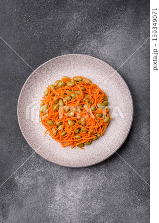 Asian salad with edamame beans, carrots, tofu, and spices. Edamame and carrot salad 139349071