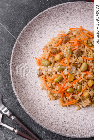 Asian food with rice, edamame, carrots, tofu, and spices. Rice with edamame and carrots 139349073