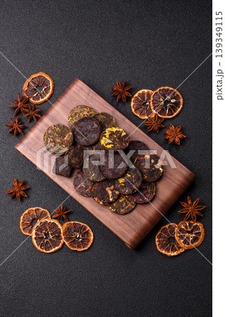 Organic Chinese green pu-erh tea with various herbs in round bricks. Chinese pu-erh tea Organic Chinese green pu-erh tea with various herbs in round bricks. Chinese pu-erh tea 139349115