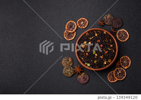 Dry black tea with herbal leaves and aromatic additives. Dry fruity black tea 139349120