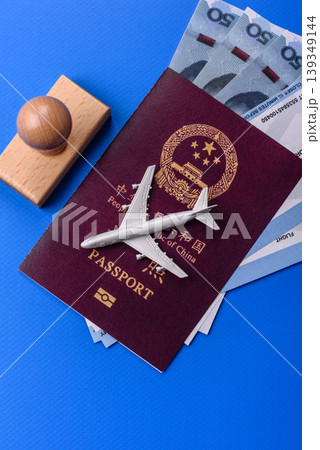 China, Chinese passport with money and flight tickets. Chinese passport 139349144