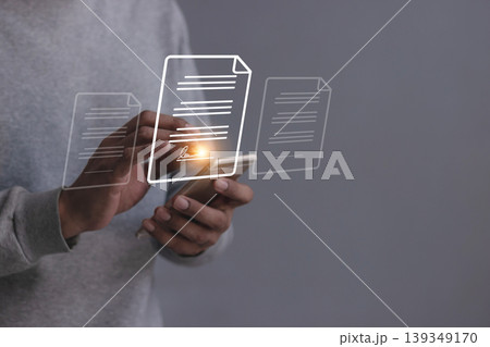 Young man with smartphone mobile hand using a pen touching to sign a Online Business Contract, Electronic signature, Contract signing, Digital documents, Future smart contract 139349170