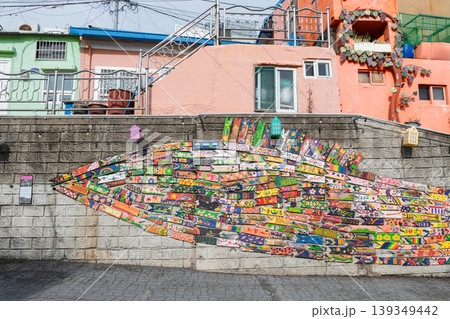 Wall decoration of wooden fish in Gamcheon Village, Busan, Korea Wall decoration of wooden fish in Gamcheon Village, Busan, Korea 139349442