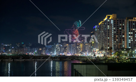 Gwangalli Drone Laser Show of hands hold red apple above city, Busan 139349457