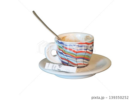 Empty colorful espresso cup on saucer with spoon 139350252