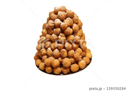 Croquembouche tower of cream puffs with caramel Croquembouche tower of cream puffs with caramel 139350284