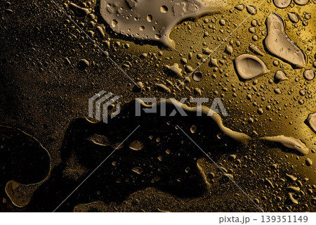 Dark molten gold metallic surface texture Dark molten gold metallic surface texture 139351149