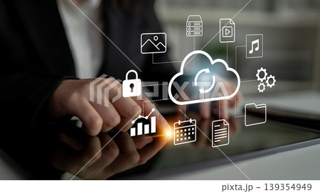 Cloud Computing Technology and Data Management Concept with Icons and Graphics on Table Demonstrating Digital Connectivity and Security in Business Environment Gantry Cloud Computing Technology and Data Management Concept with Icons and Graphics on Table Demonstrating Digital Connectivity and Security in Business Environment Gantry 139354949