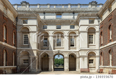 Timeless symmetry in Portland stone. The orderly Neoclassical design of the Old Royal Naval College reflects a sense of permanence, with its grand central arch acting as a gateway between historic Timeless symmetry in Portland stone. The orderly Neoclassical design of the Old Royal Naval College reflects a sense of permanence, with its grand central arch acting as a gateway between historic 139355670