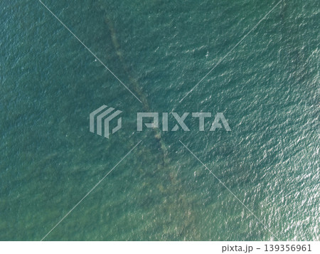 Wreck remains visible under calm water in coastal area Wreck remains visible under calm water in coastal area 139356961