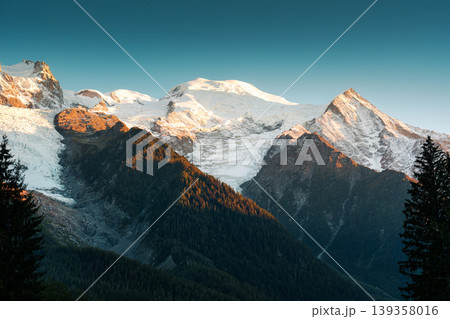 Alpine snowcapped mountain with mont blanc peak during autumn in evening Alpine snowcapped mountain with mont blanc peak during autumn in evening 139358016