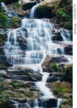Waterfall cascading over rocky terrain in tropical forest at Vietnam Waterfall cascading over rocky terrain in tropical forest at Vietnam 139358157