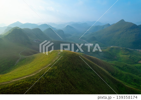 Lush green rolling hill of Ba Quang Grass Hill in countryside during morning at Vietnam 139358174