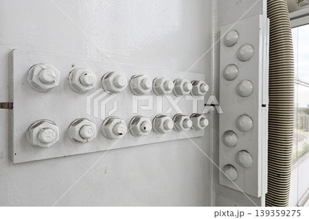 Structural Joint on a White Painted Steel Wall. Structural Joint on a White Painted Steel Wall. 139359275