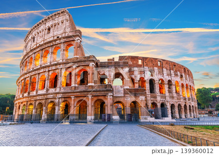 Colosseum at sunset with dramatic colorful sky in Rome, Italy Colosseum at sunset with dramatic colorful sky in Rome, Italy 139360012