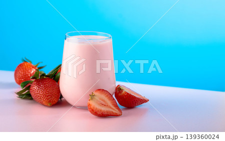Strawberry yogurt and fresh berries on a colorful background. 139360024