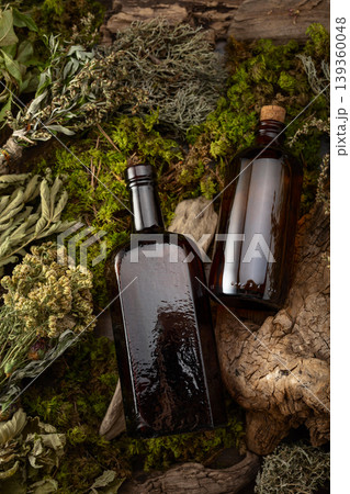 Vintage bottles with tinctures and various dried herbs. Vintage bottles with tinctures and various dried herbs. 139360048